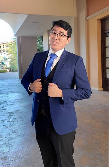 A person in a suit and tie

Description automatically generated with low confidence